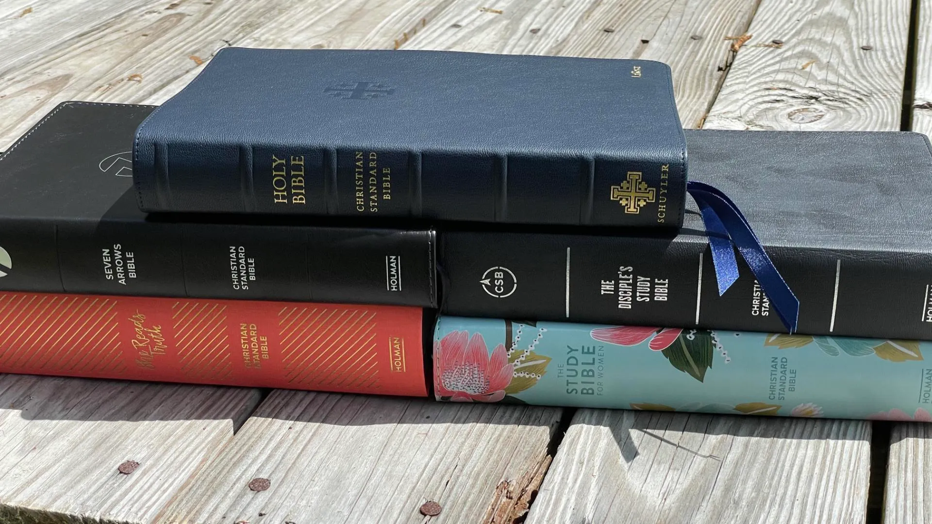 Christian Standard Bible (CSB) translation resting on a wooden table