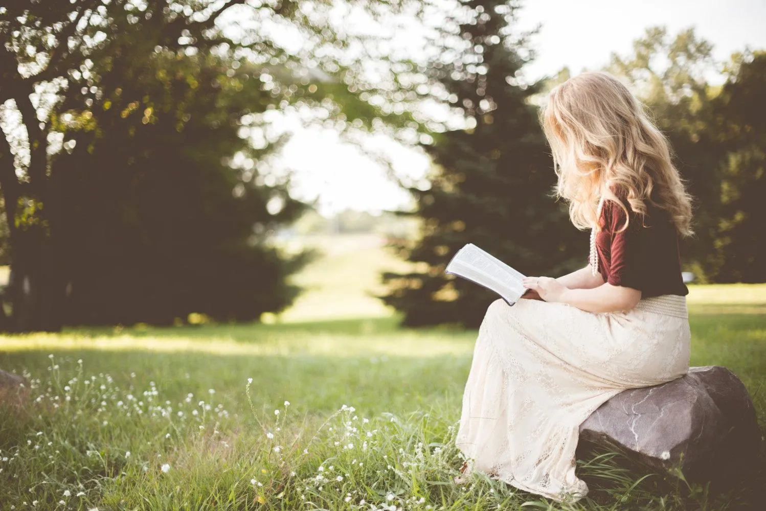 Person quietly reflecting on Scripture during biblical meditation