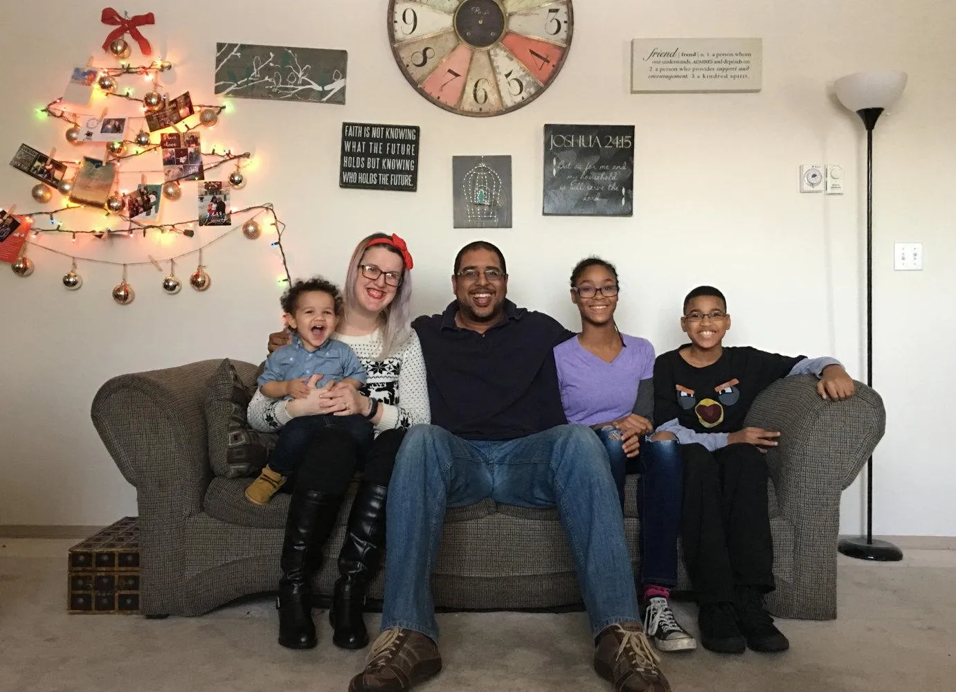 Family gathered together for a time of family worship and devotion